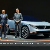 Makoto Uchida and Ashwani Gupta pose with a Nissan Chill-Out concept car.