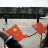 Chinese military vehicles carrying DF-41 ballistic missiles roll during a parade.
