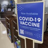 A Covid-19 vaccine sign at a grocery store