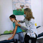An Israeli child receives a Covid-19 vaccine shot in Tel Aviv.