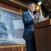Sen. Joe Manchin speaks with reporters during a news conference.