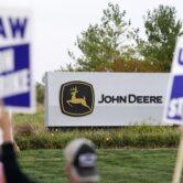 Union members strike outside a John Deere plant