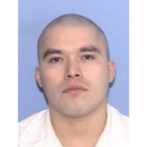 John Henry Ramirez, a Texas death row inmate, poses for a photo.