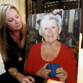 M.J. Jennings looks at a photo of her mother Leah Corken.