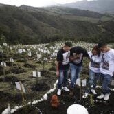 Relatives visit the grave of a Covid-19 victim in Colombia.