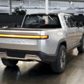 A Rivian R1T is shown at company headquarters.