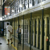 A condemned inmate leaves his cell on death row at San Quentin State Prison.