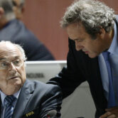 Sepp Blatter and Michel Platini speak during a FIFA meeting.