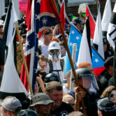 White nationalist demonstrators walk in Charlottesville, Va.