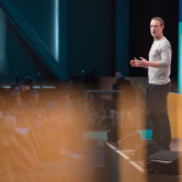 Mark Zuckerberg speaks on stage during a Facebook summit.