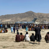People gather at the international airport in Kabul, Afghanistan.