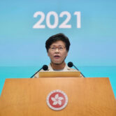 Carrie Lam listens to reporters' questions during a press conference in Hong Kong.
