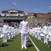 Cadets stand before a commencement ceremony at the U.S. Coast Guard Academy
