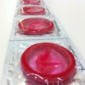 A strip of red condoms.