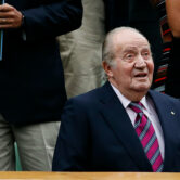 Former Spanish King Juan Carlos takes his seat at the Wimbledon Tennis Championships.