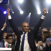 French presidential candidate Eric Zemmour waves after a rally