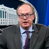 Jeffrey Clark speaks during a news conference at the Justice Department.
