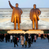 Citizens visit bronze statues of Kim Il Sung and Kim Jong Il in North Korea.