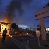 A bank burns after a protest over the death of George Floyd in La Mesa, Calif.