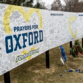 Messages are written on a prayer wall outside Oxford High School