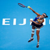 Peng Shuai serves during a women's singles match at the China Open.