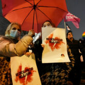 Women demonstrate in front of the Polish parliament in Warsaw, Poland.