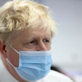 Boris Johnson looks on during a visit to Finchley Memorial Hospital.