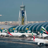 An Emirates jetliner comes in for a landing at the Dubai International Airport.