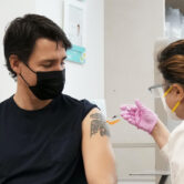 Justin Trudeau receives his Covid-19 vaccine booster shot.