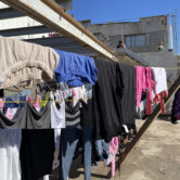 Clothes hanging at migrant shelter