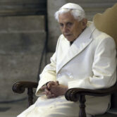 Pope Emeritus Benedict XVI sits in St. Peter's Basilica at the Vatican.