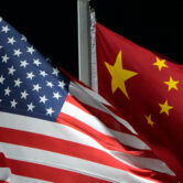 The American and Chinese flags wave in Zhangjiakou, China.