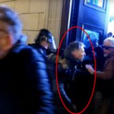 Man tries to hold open door during Capitol riot