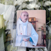 A picture of the late Father Jacques Hamel at a makeshift memorial in France.