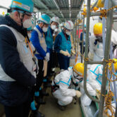 IAEA members inspect the site of the Fukushima nuclear plant.