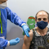 A person receives a Covid-19 vaccine shot in Austria.