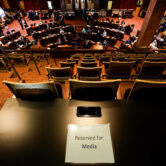 A "Reserved for Media" sign sits on a table in the Iowa Senate gallery.