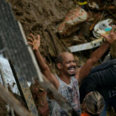 A resident yells during the search for survivors after fatal mudslides in Petropolis, Brazil.
