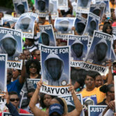 Protesters hold signs during a march for Trayvon Martin in Florida in 2012.