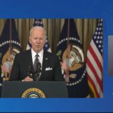 Biden stands at a podium to give a speech on the national budget.