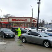 cars lined up in front of gas station