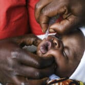 A baby receives a polio vaccine during the Malawi Polio Vaccination Campaign Launch.