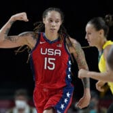 Brittney Griner flexes after making a basket during the 2020 Summer Olympics.