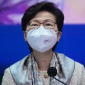 Carrie Lam listens to reporters' questions during a press conference in Hong Kong.