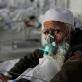 An elderly Covid-19 patient in an ICU in Afghanistan.