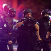 Denver Police officers use tear gas and rubber bullets to disperse a racial justice protest.