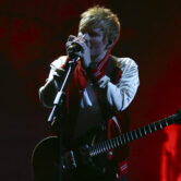 Ed Sheeran performs on stage at the Brit Awards 2022 in London.