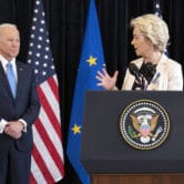 Joe Biden listens to Ursula von der Leyen as she speaks in Brussels.