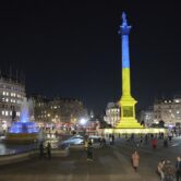 London’s Trafalgar Square is lit up with the colors of the Ukraine flag