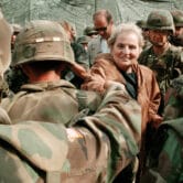Madeleine Albright greets U.S. solders at Camp Bondsteel.